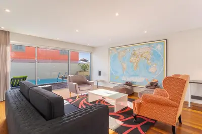 a living room with a couch and a table at Villa Nogueira V with Private Pool by Holiday Rental Madeira in Funchal