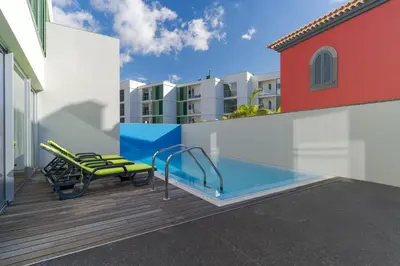 a swimming pool on the roof of a building at Villa Nogueira V with Private Pool by Holiday Rental Madeira in Funchal