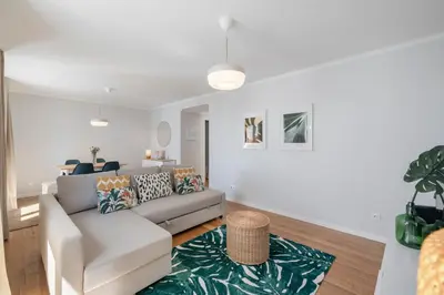 a living room with a couch and a rug at Solar da Fontinha by An Island Apart in Santa Cruz