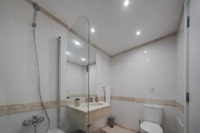 a bathroom with a shower and a toilet and a sink at Solar da Fontinha by An Island Apart in Santa Cruz