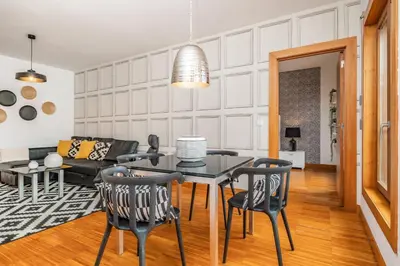 a living room with a table and chairs at Apartamento Centralis by Homie in Funchal