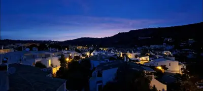 a view of a town at night at Seaview Apartment 100m from beach in Luz