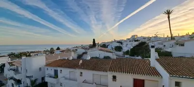 a view of a town with white houses and the ocean at Seaview Apartment 100m from beach in Luz