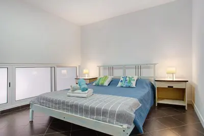 a bedroom with a dog laying on a bed at Funchal Boa Nova Apartment in Funchal