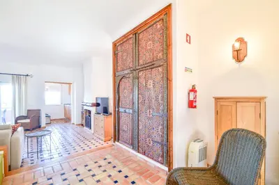 a living room with a large wooden door at Apartment Luz Views by MOJE Holiday in Luz