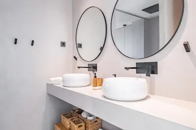 a bathroom with two sinks and a large mirror at House of Cork and Ivy - By WeHost in Câmara de Lobos