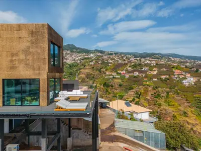 a house on a hill with a view at House of Cork and Ivy - By WeHost in Câmara de Lobos