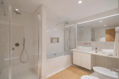a bathroom with a shower and a toilet and a sink at CASA DO MIRADOURO 6 by Heart of Funchal in Funchal