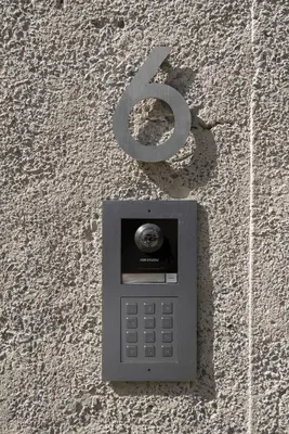 a cell phone with the number six attached to a wall at CASA DO MIRADOURO 6 by Heart of Funchal in Funchal