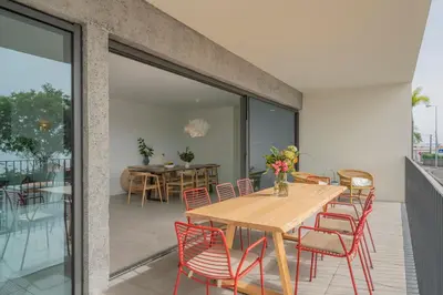 a dining room with a wooden table and chairs at CASA DO MIRADOURO 5 by Heart of Funchal in Funchal