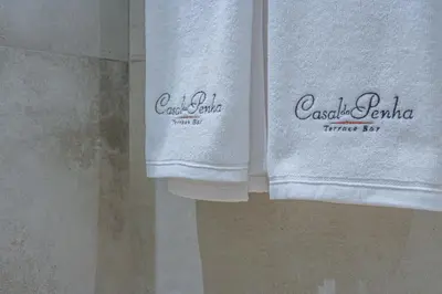 a pair of towels hanging in a bathroom at Casal da Penha Apartments in Funchal