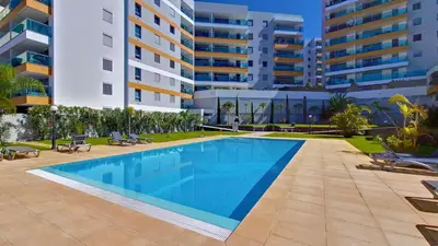 a swimming pool in front of a building at Rainbow Apartment by LovelyStay in Funchal