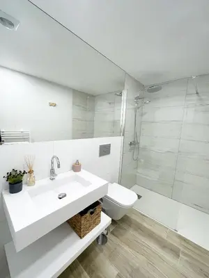 a bathroom with a sink and a toilet and a shower at Nōhō house in Carrapateira