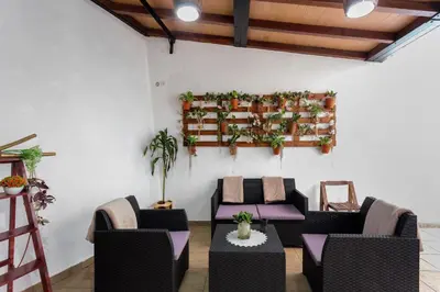 a balcony with a view of a street and a wall at Moradia Casa Feliz in Santa Cruz