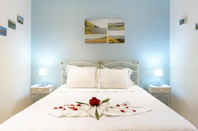 a bedroom with a bed and a window at Bela casa na Costa Vicentina in Aljezur