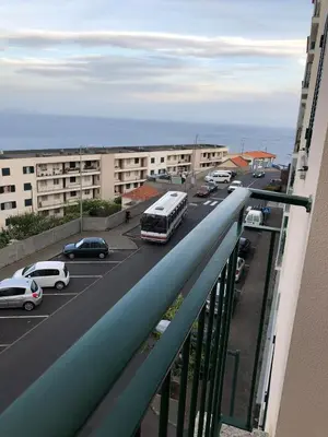 a view of a city street with cars and a bus at Ocean Garden in Caniço