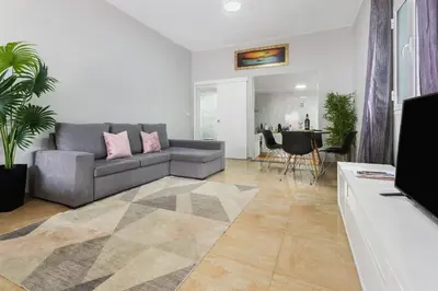 a living room with a couch and a table at Studio Home Away from Home in Caniçal