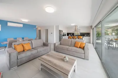 a living room with two couches and a table at OurMadeira - Arco Sun in Arco da Calheta