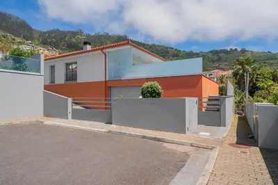 a house with an orange and white at OurMadeira - Arco Sun in Arco da Calheta