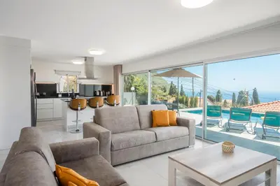a living room with a couch and a table at OurMadeira - Arco Sun in Arco da Calheta