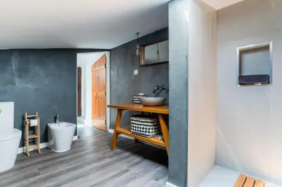 a bathroom with a sink and a toilet at Casa Alfambras - Holiday Cottage in Aljezur by Lisbeyond in Aljezur