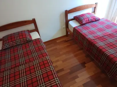 two beds sitting next to each other in a room at Costa Lodges Funchal or Santa Cruz, Madeira in Santa Cruz
