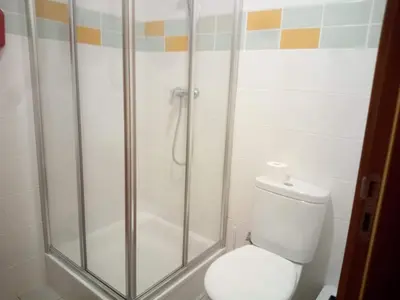 a bathroom with a shower and a toilet at Costa Lodges Funchal or Santa Cruz, Madeira in Santa Cruz