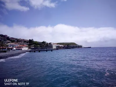 a view of a body of water with a town at Costa Lodges Funchal or Santa Cruz, Madeira in Santa Cruz