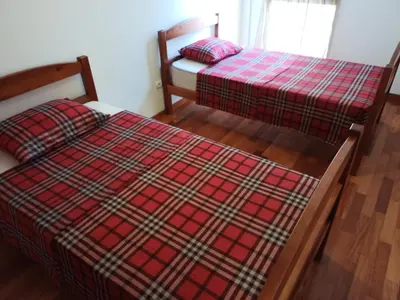 two beds sitting next to each other in a room at Costa Lodges Funchal or Santa Cruz, Madeira in Santa Cruz