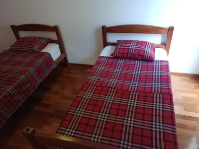 two beds sitting next to each other in a room at Costa Lodges Funchal or Santa Cruz, Madeira in Santa Cruz
