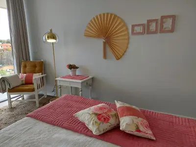 a bedroom with a bed with two pillows on it at Stunning Lobos View in Câmara de Lobos
