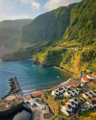 an aerial view of a beach with a mountain at Casa da Portada in Seixal