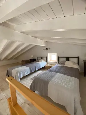 a bedroom with two beds in a attic at Sunny Aljezur da Viana, (Aljezur, Costa Vicentina) in Aljezur