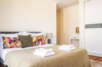 a bedroom with a large bed with towels on it at Uptown Sea View by Homie in Funchal