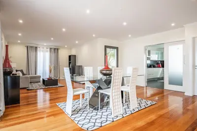 a dining room and living room with a table and chairs at Uptown Sea View by Homie in Funchal
