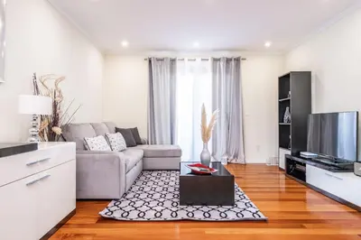 a living room with a couch and a tv at Uptown Sea View by Homie in Funchal