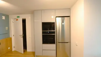 a kitchen with a stainless steel refrigerator and appliances at Marina Club Studio Traveller Hideaway in Funchal