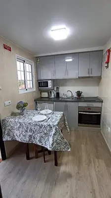 a kitchen with a table with a table cloth on it at A Toca in Santana