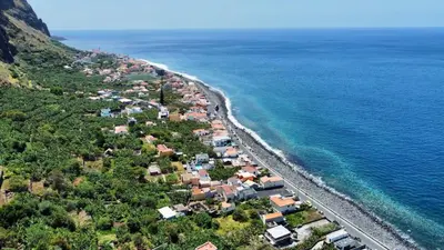 an aerial view of a beach next to the ocean at Blue by the Sea House in Paul do Mar