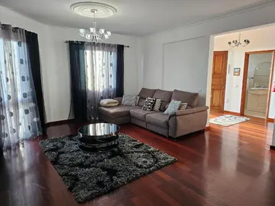 a living room with a couch and a table at Casa de Feria do Livramento in Funchal