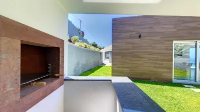 a view of the backyard from the side of a house at Villa Blue Horizon by LovelyStay in Tábua