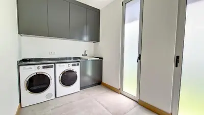 a laundry room with a washer and dryer at Villa Blue Horizon by LovelyStay in Tábua