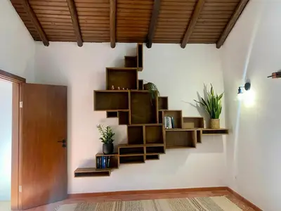 a room with wooden shelves on the wall at O Ninho in Atalaia