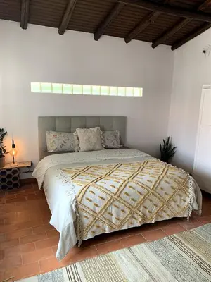 a bedroom with a large bed in a room at O Ninho in Atalaia