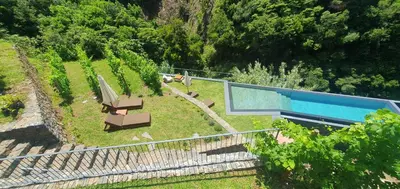 an overhead view of a house with a swimming pool at Terrabona Nature & Vineyards in Boaventura