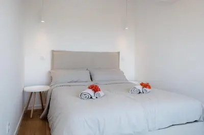 a bedroom with a white bed with two pillows on it at GuestReady - A delightful stay in Porto Santo in Pontinhas