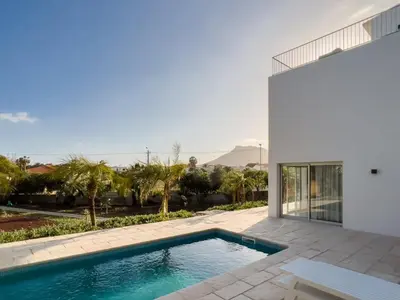 a swimming pool in the backyard of a house at GuestReady - A delightful stay in Porto Santo in Pontinhas