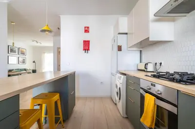 a kitchen with a counter and a stove top oven at Clifftop Nest Arrifana by Lisbeyond in Aljezur