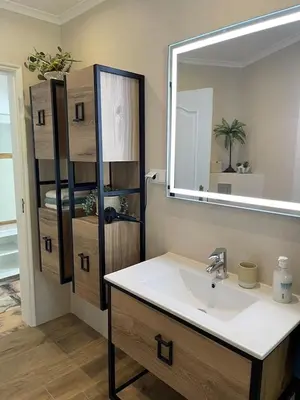 a bathroom with a sink and a mirror at Villa Lagos Algarve for families & friends, 6 bedrooms, 7 bathrooms, pool, BBQ, central heating in Pedra Alçada