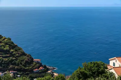 a view of the ocean from a hill at Calheta Victory View by An Island Apart in Calheta